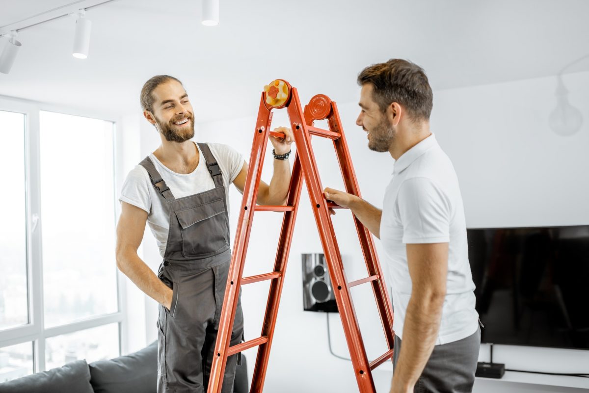 Two workmen talking during some repairment at home